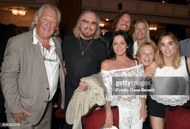 David English, Barry Gibb, Linda Gibb, Ashley Gibb, Therese Gibb, Lucas Gibb and Alexandra Gibb attend the Nordoff Robbins O2 Silver Clef Awards at...