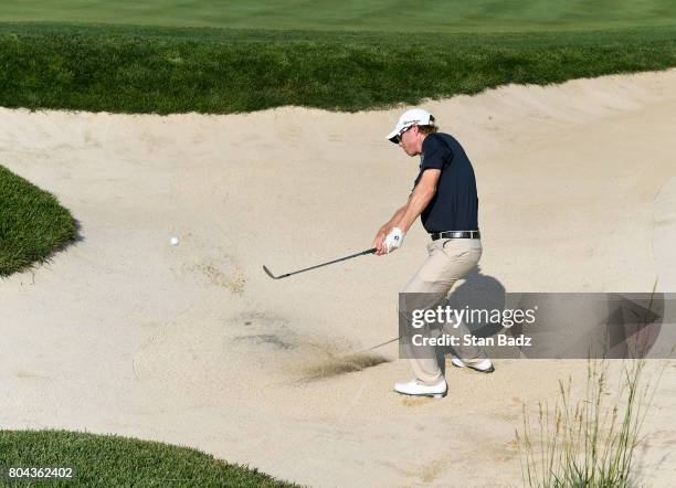 David Hearn of Canada plays a bunker shot on the 17th hole during the second round of the Quicken Loans National at TPC Potomac at Avenel Farm on...
