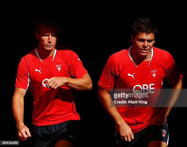 Craig Bolton and Craig Bird walk onto the field during a Sydney Swans AFL recovery session held at the Sydney Cricket Ground on March 31, 2008 in...