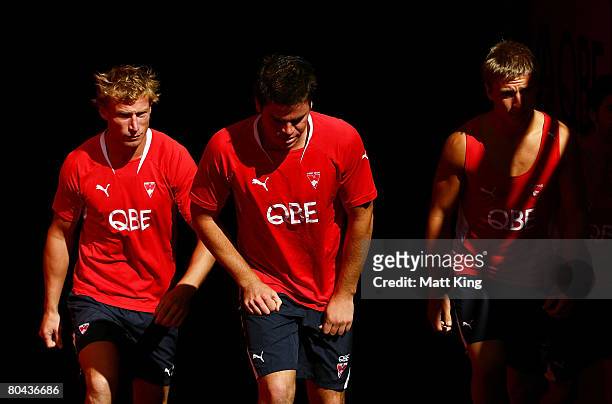 Craig Bolton, Craig Bird and Chris Jack walk onto the field during a Sydney Swans AFL recovery session held at the Sydney Cricket Ground on March 31,...