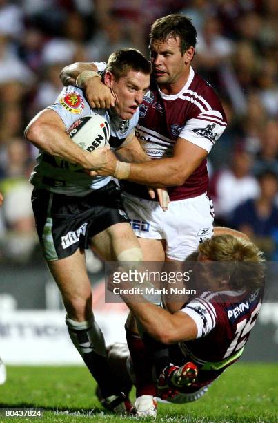 Brent Tate of the Warriors is tackled during the round three NRL match between the Manly Warringah Sea Eagles and the Warriors at Brookvale Oval on...