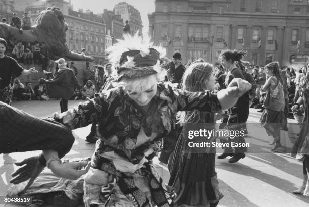 New Age hippies, or Crusties, dancing in Trafalgar Square, London, July 1993.