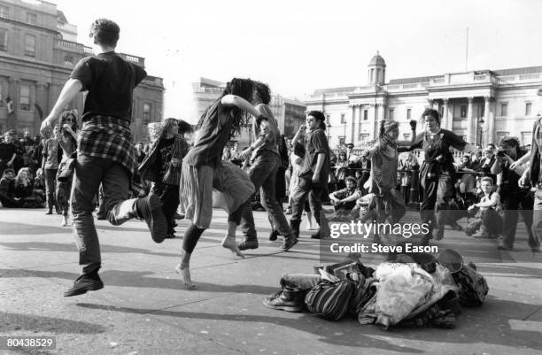 New Age hippies, or Crusties, dancing in Trafalgar Square, London, July 1993.