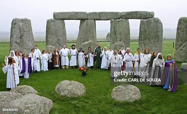 File picture taken on October 17, 2006 shows druids perfoming a pagan Samhain blessing ceremony at Stonehenge, in Avebury, Wiltshire, in southern...