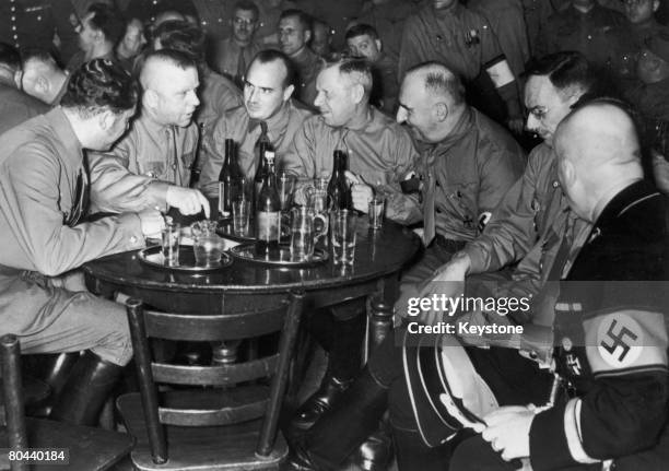 Prominent Nazi Party members at a party to mark the 15th anniversary of the 1923 Beer Hall Putsch, Munich, 9th November 1938. Among the group are...