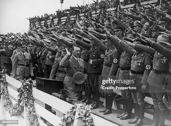 Nazi leader Adolf Hitler salutes the crowds at the Nuremberg Rally ...