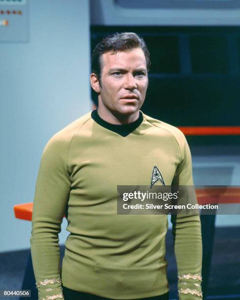 Canadian actor William Shatner as Captain James T. Kirk of the Starship Enterprise in the classic science fiction television series 'Star Trek',...