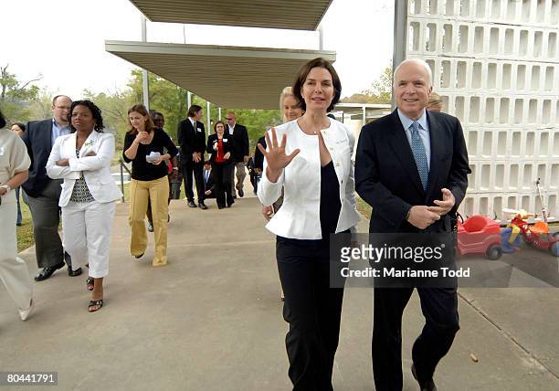 Republican presidential candidate Sen. John McCain walks with actress Sela Ward at Hope Village for Children March 31, 2008 in Meridian, Mississippi....