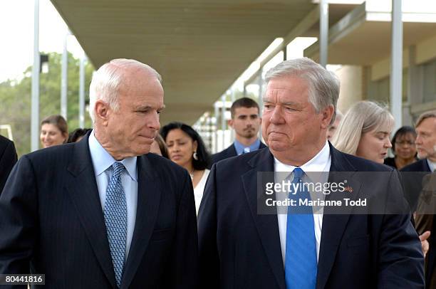 Republican presidential candidate Sen. John McCain walks with Mississippi Gov. Haley Barbour at Hope Village for Children March 31, 2008 in Meridian,...