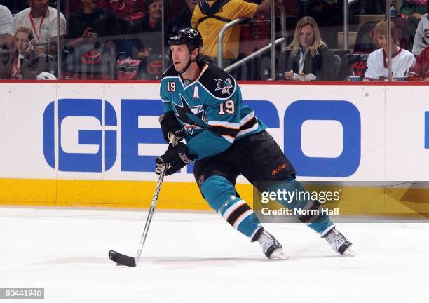 Center Joe Thornton of the San Jose Sharks looks to pass the puck against the Phoenix Coyotes on March 25, 2008 at Jobing.com Arena in Glendale,...