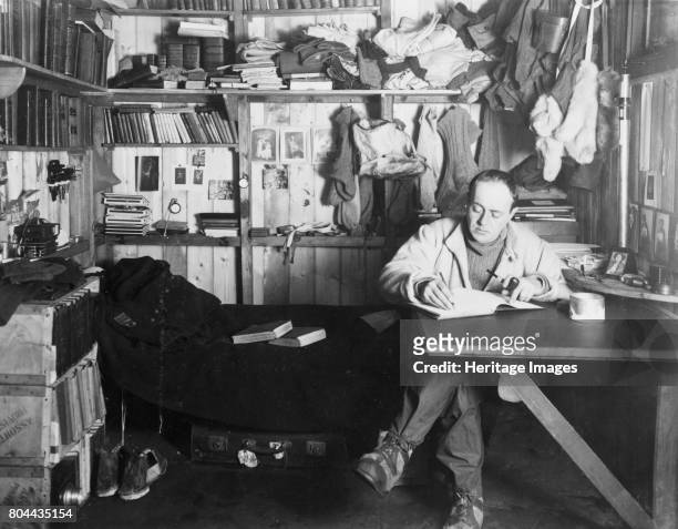 Captain Scott, British polar explorer, in the Antarctic, 1911. Scott in his den at Winter Quarters, during the 'Terra Nova' Expedition to the South...