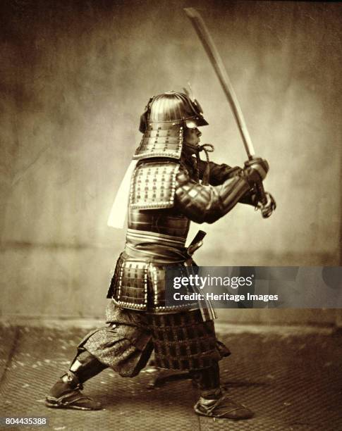 Samurai with raised sword, c1860.