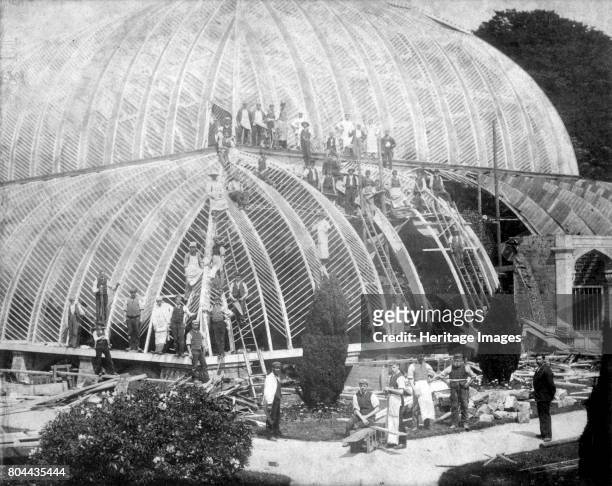 Making repairs to the Great Conservatory at Chatsworth, Derbyshire, late 19th century. The great glasshouse on the Duke of Devonshire's estate at...