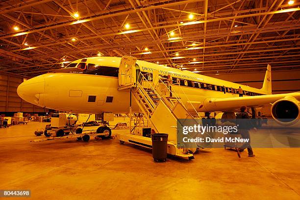 Final preparations are made to a DC-8 jet to be used by the National Aeronautics and Space Administration as a flying laboratory in one of the...