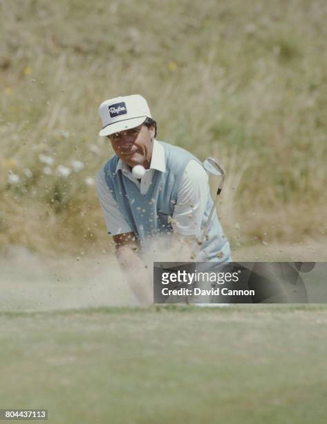 Gary Player of South Africa chips out of a bunker during the 114th Open Championship on 18 July 1985 at the Royal St George's Golf Club in Sandwich,...