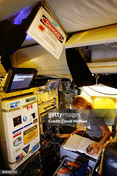 Anne Perring, of University of California Berkley, makes final preparations of equipment marked with warning signs for measuring nitrogen dioxide in...
