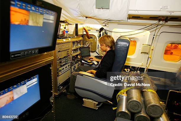 Armin Wisthaler, an assistant professor at the University of Innsbruck, in Austria, makes final adjustments to a mass spectrometer, developed at the...