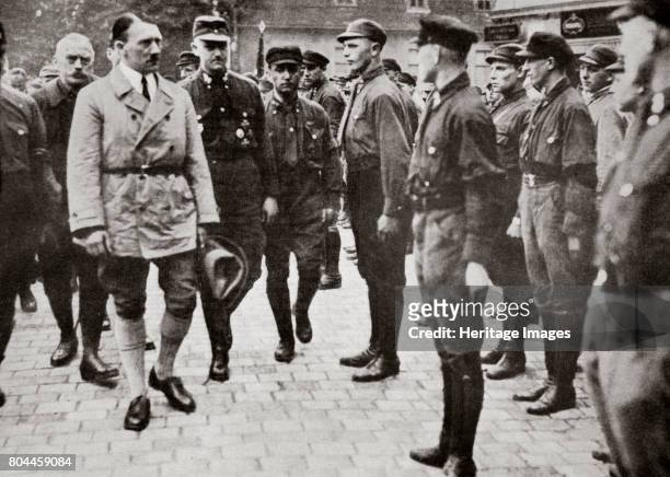 Hitler inspecting a group of SA Members during World War II, Germany, 1939-1945. Founded in c1919, the Sturmabteilung was the paramilitary wing of...
