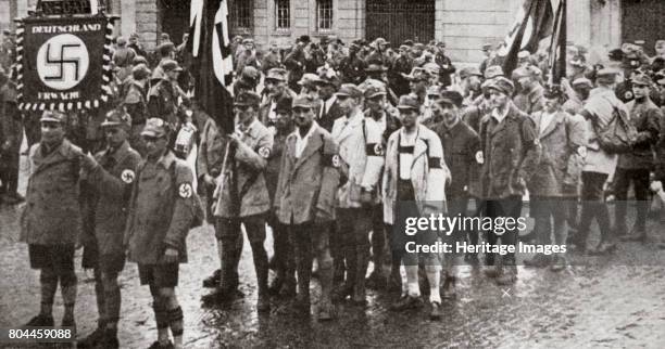 Parade by members of the SA, Weimar, Germany, 1926. Founded in c1919, the Sturmabteilung was the paramilitary wing of the Nazi party. Its members...
