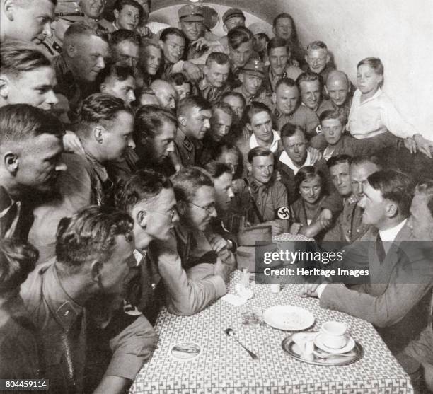 The supreme SA leader Adolf Hitler with his comrades', 1938. Founded in c1919, the Sturmabteilung was the paramilitary wing of the Nazi party. Its...