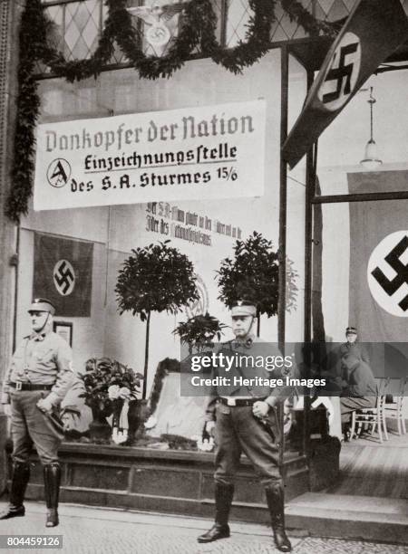 World War I veterans register for the SA, Germany, 1938. Founded in c1919, the Sturmabteilung was the paramilitary wing of the Nazi party. Its...