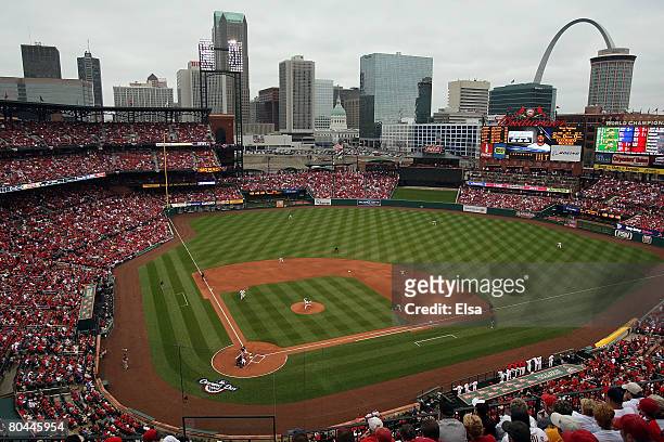 Adam Wainwright of the St. Louis Cardinals throws the first pitch of the game to Willy Taveras of the Colorado Rockies on opening day at Busch...