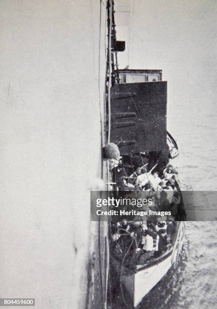 View from the 'Carpathia' of a lifeboat from the 'Titanic' brought alongside, 15 April, 1912. Operated by the White Star Line, RMS 'Titanic' was the...