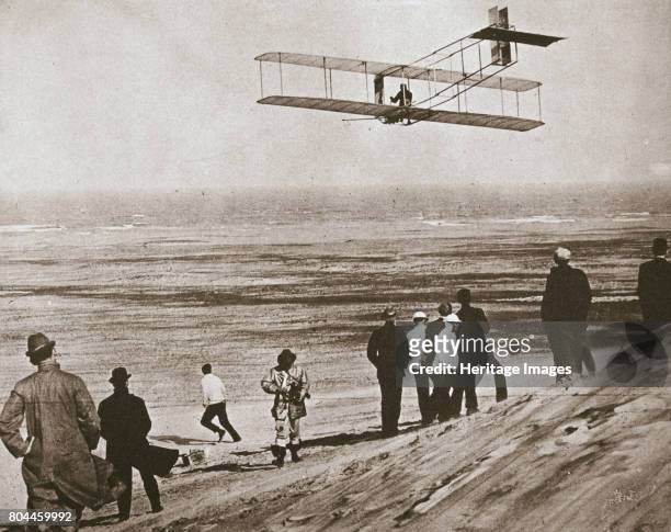 The Wright Brothers testing an early plane at Kitty Hawk, North Carolina, USA, c1903. Wilbur and Orville Wright testing a plane with an engine...