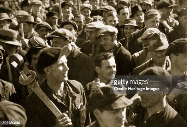 Factory workers with their tools celebrate the traditional Socialist holiday, Germany, 1936. May 1st, the German Workers' National Holiday. From...