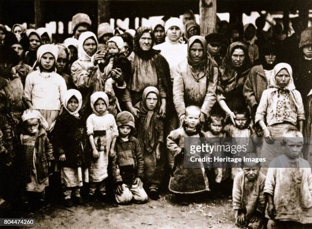 Famine in the Volga Valley, Russia, c1921-c1922. The aftermath of the Russian Revolution and Civil War. Groups of peasants starving. A combination of...