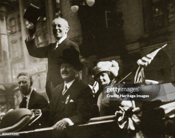 Woodrow Wilson returns from Paris after the signing of the Treaty of Versailles, 1919. Riding through New York City, President Woodrow Wilson , with...