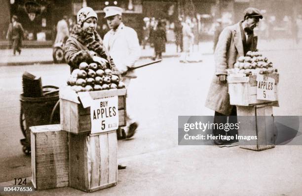 Jobless New Yorkers selling apples on the pavement, Great Depression, New York, USA, 1930.