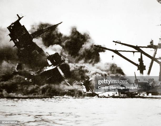 Battleship USS 'Arizona' sinking during the attack on Pearl Harbour, 1941. The Japanese Navy launched a surprise attack on the US military facilities...