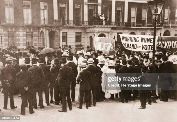 Spectators gather on Portland Place to watch the Women's Sunday procession, London, 21 June 1908. On Sunday 21 June 1908 thousands of people gathered...