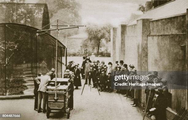 Broadcast from the aviary at London Zoo, 20th century. Officials of the British Broadcasting Corporation, preparing to broadcast sounds from the...