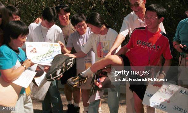 Korean tourist during his visit to Universal Studios compares his foot to Shaquille O'' Neal's size 22 court shoe during the "Shaqtacular V" event...