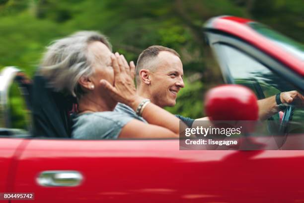 mother and son in a convertible - toyota stock pictures, royalty-free photos & images