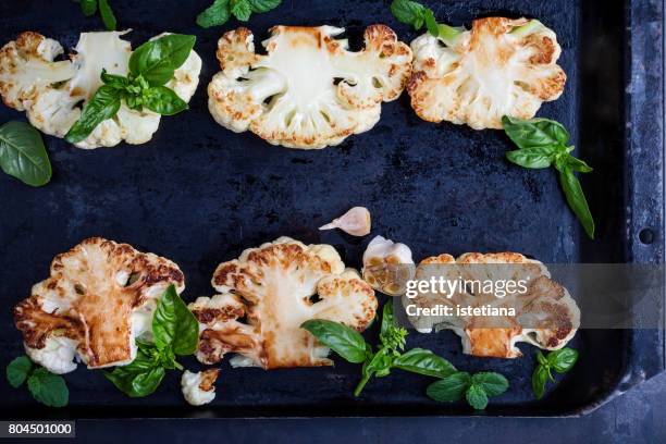 roasted organic cauliflower steak on baking dish - カリフラワー ストックフォトと画像