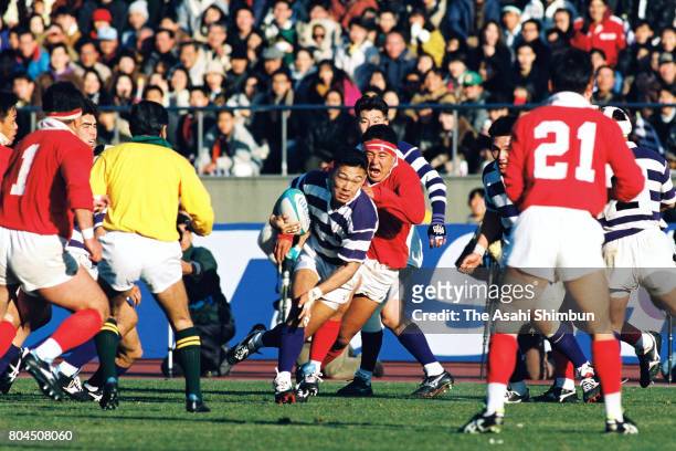 Yukio Motoki of Meiji University runs with the ball during the 31st All-Japan Rugby Football Championship Final match between Kobe Steel and Meiji...