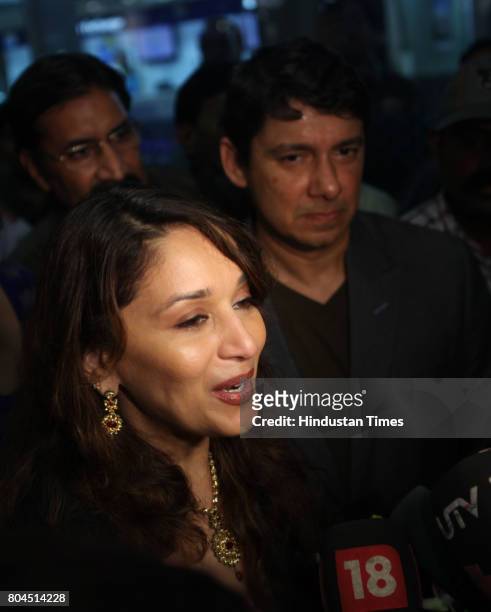Bollywood actress Madhuri Dixit Nene reach Mumbai airport along with husband Dr. Sriram Madhav Nene and kids on Friday evening.
