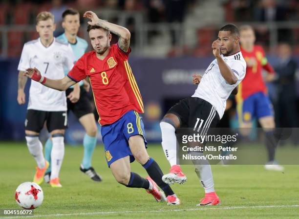 Saul Niguez of Spain and Serge Gnabry of Germany in action during the UEFA European Under-21 Championship Final between Germany and Spain at Krakow...