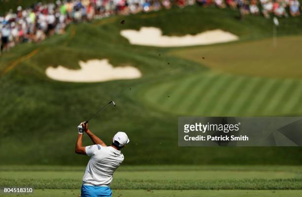 Rickie Fowler of the United States plays his shot from the ninth tee during the second round of the Quicken Loans National on June 30, 2017 TPC...