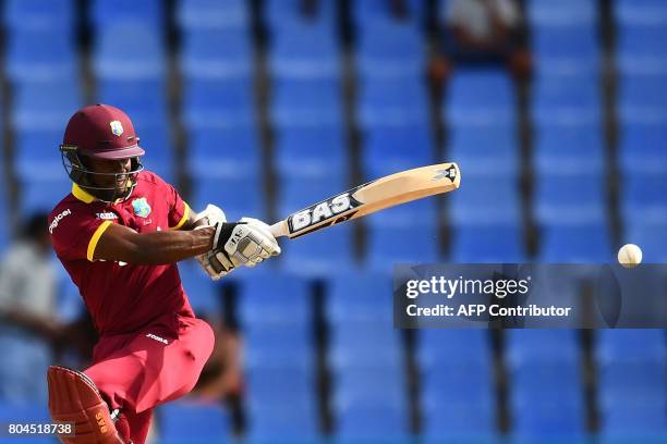 West Indies' Jason Mohammed plays a shot during the third One Day International match between West Indies and India, at the Sir Vivian Richards...