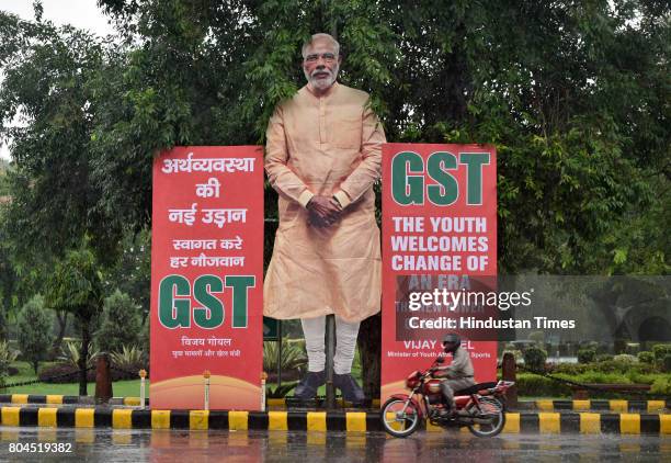 Giant cut-out of Prime Minister Narendra Modi installed at Ashok Road in favour of GST on June 30, 2017 in New Delhi, India. With a gong sound at...