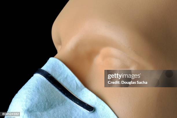 close-up of a workers disposable respirator for lung protection - respiratory protection construction stock pictures, royalty-free photos & images