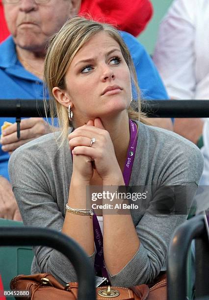 Model Brooklyn Decker watches as her fiancee Andy Roddick takes on Ivo Minar of the Czech Republic during day eight of the Sony Ericsson Open at the...