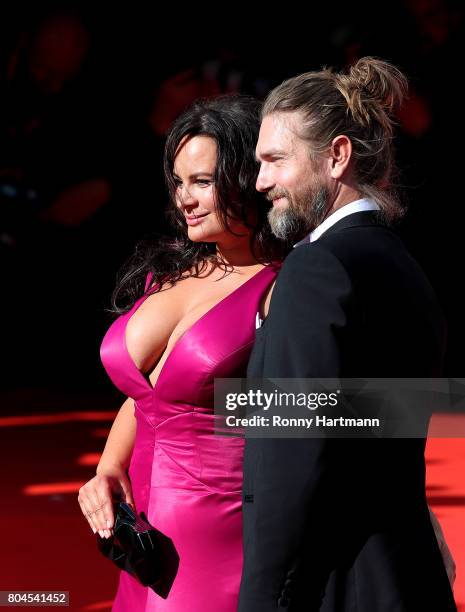 Czech actress Jitka Cvancarova and Petr Cadek arrive at the opening ceremony of the 52st Karlovy Vary International Film Festival on June 30, 2017 in...