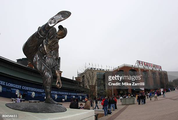 Fans walk around the pavilion near the Warren Spahn statue before the game between the Atlanta Braves and the Pittsburgh Pirates at Turner Field...