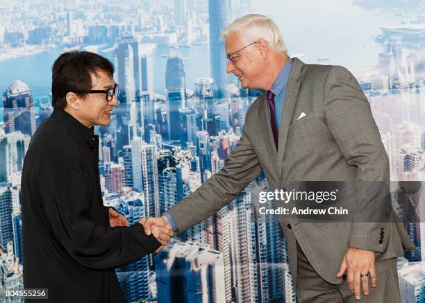 Actor and martial artist Jackie Chan greets President and CEO of Vancouver Airport Authority Craig Richmond during the celebration of Hong Kong...