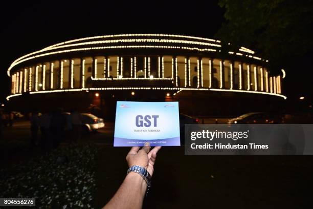 Bill pass in parliament house on July 1, 2017 in New Delhi, India. With a gong sound at midnight in Parliament's Central Hall, India will switch to...